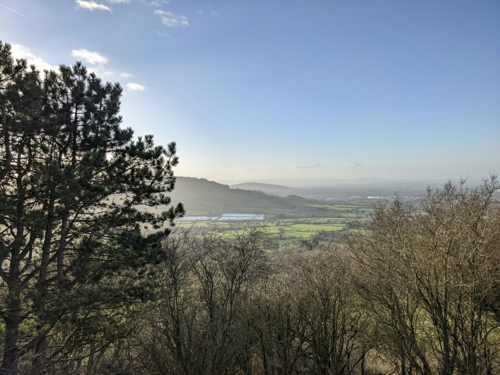 View of a valley from a hill, typical of countryside walking routes